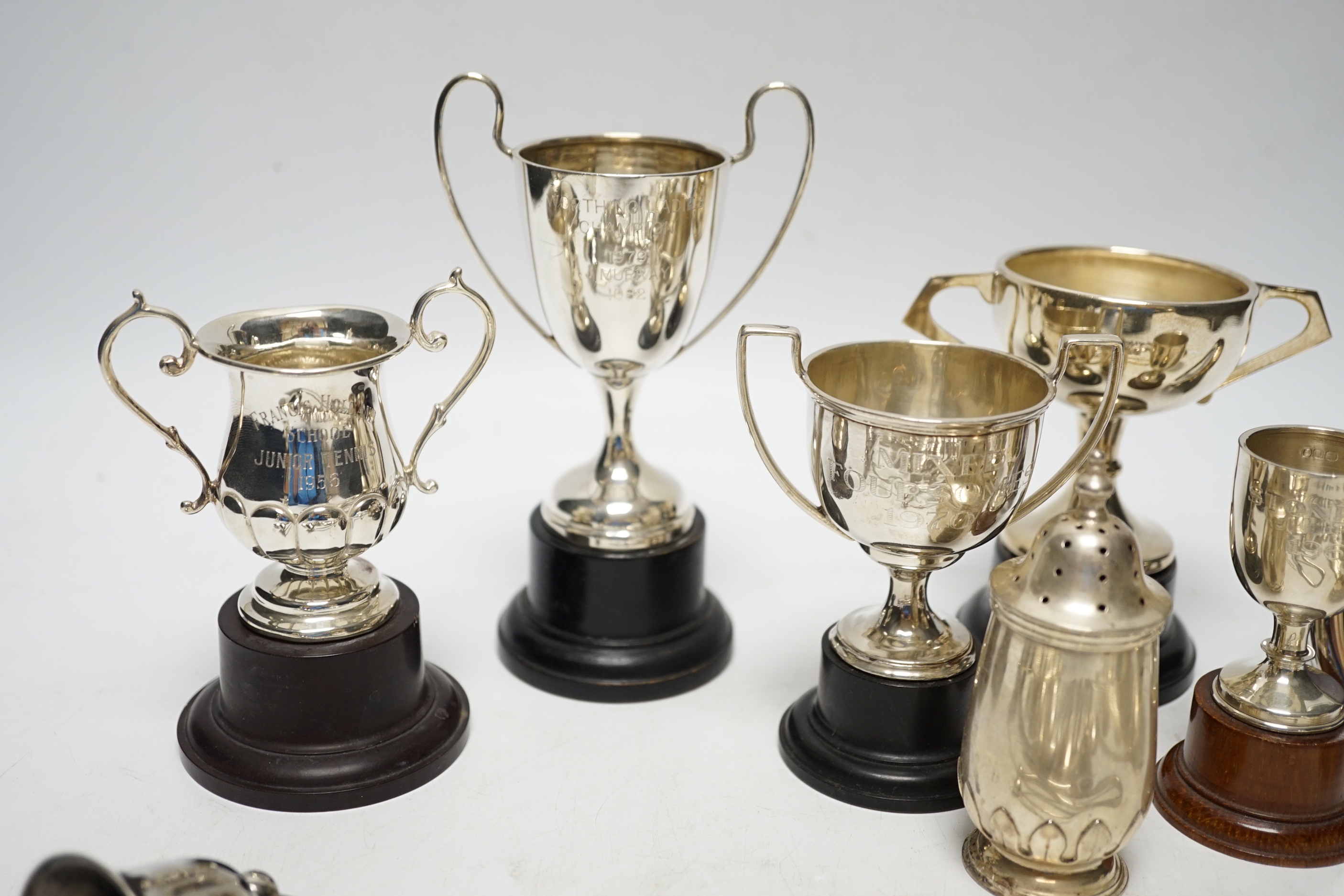 Sundry minor silver flatware including a Victorian Kings pattern sifter ladle, a silver mustard pot and pepperette, four small silver trophy cups and two other items.